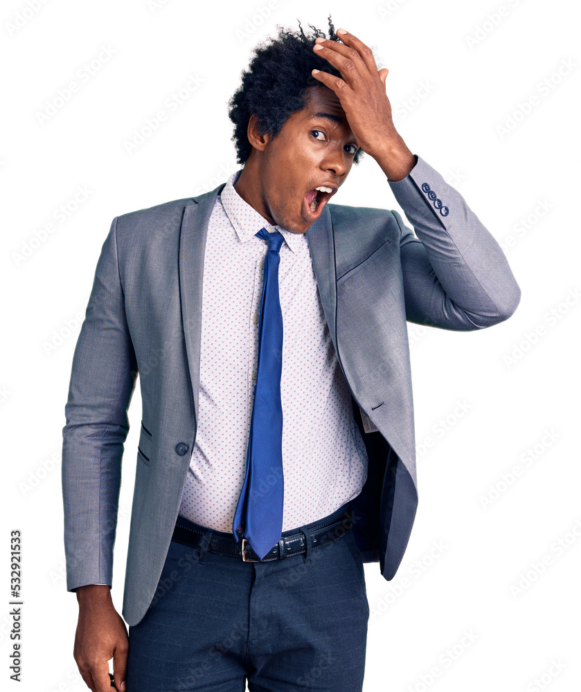 Handsome african american man with afro hair wearing business jacket surprised with hand on head for mistake, remember error. forgot, bad memory concept. Handsome african american man with afro hair wearing business jacket surprised with hand on head for mistake, remember error. forgot, bad memory concept.