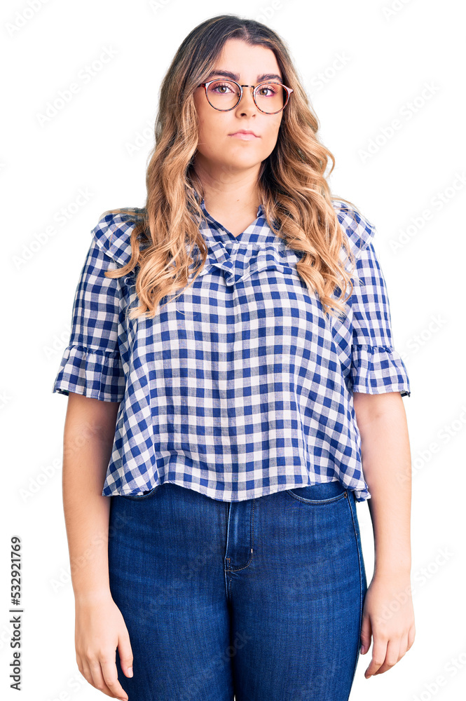Young caucasian woman wearing casual clothes relaxed with serious expression on face. simple and natural looking at the camera. Young caucasian woman wearing casual clothes relaxed with serious expression on face. simple and natural looking at the camera.
