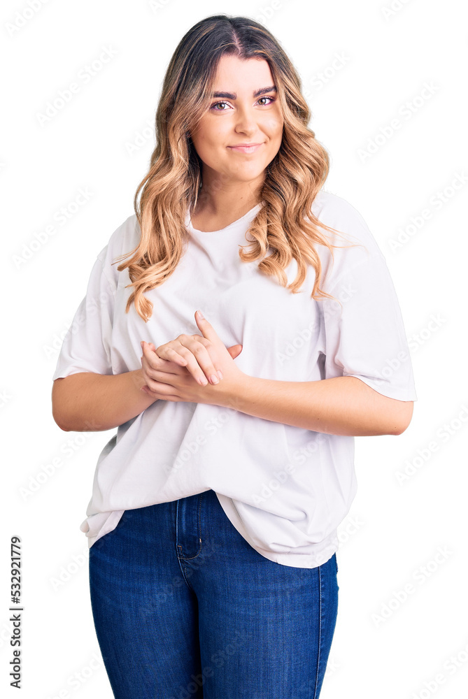 Young caucasian woman wearing casual clothes with hands together and crossed fingers smiling relaxed and cheerful. success and optimistic Young caucasian woman wearing casual clothes with hands together and crossed fingers smiling relaxed and cheerful. success and optimistic
