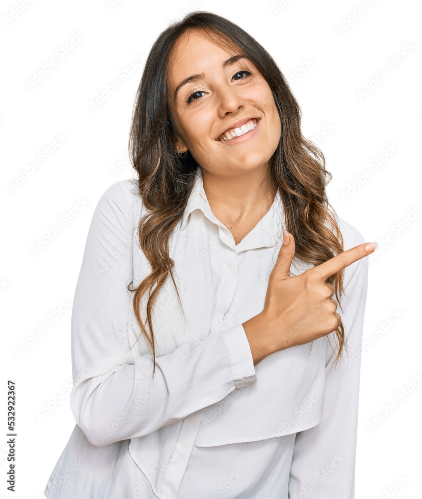 Young brunette woman wearing casual clothes cheerful with a smile of face pointing with hand and finger up to the side with happy and natural expression on face Young brunette woman wearing casual clothes cheerful with a smile of face pointing with hand and finger up to the side with happy and natural expression on face