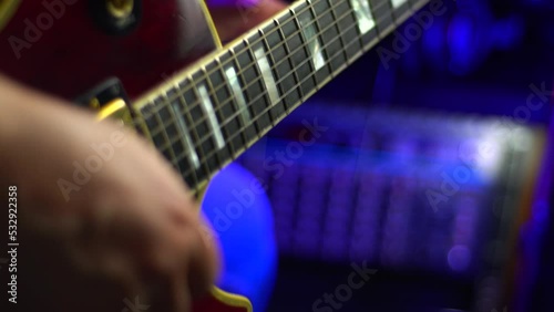 lead guitarist playing electrical guitar at studio	
