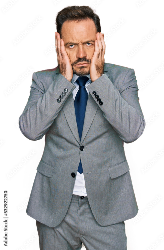 Middle age man wearing business clothes tired hands covering face, depression and sadness, upset and irritated for problem Middle age man wearing business clothes tired hands covering face, depression and sadness, upset and irritated for problem