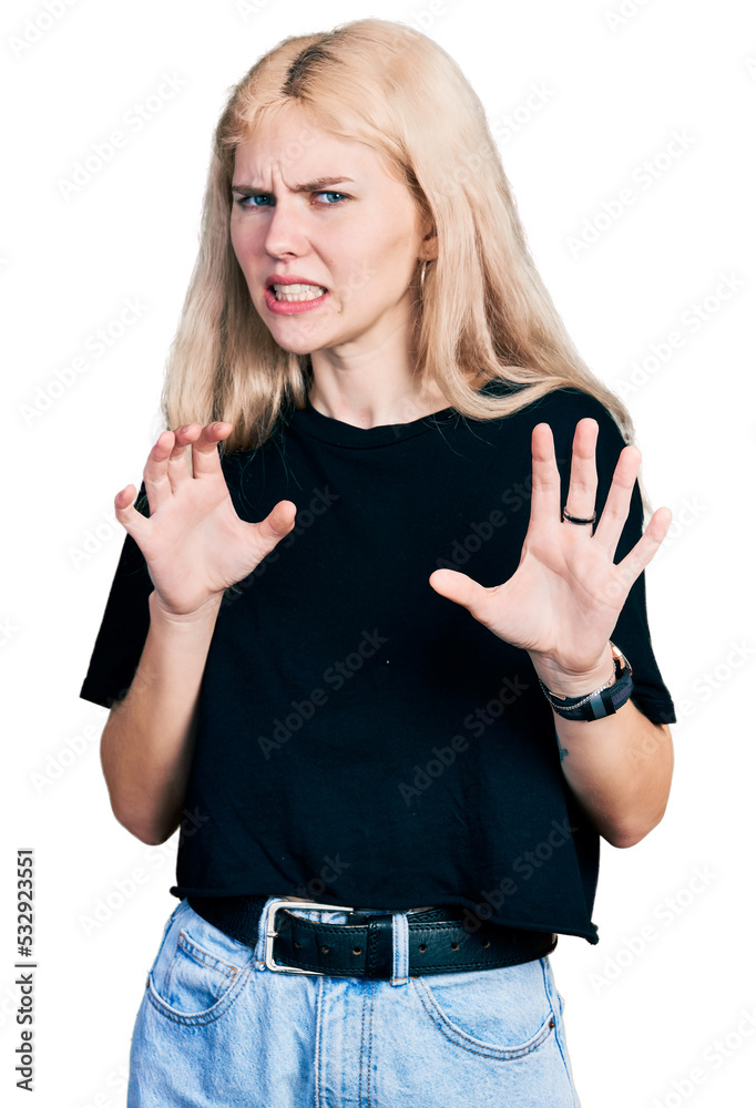 Young caucasian woman wearing casual clothes disgusted expression, displeased and fearful doing disgust face because aversion reaction. with hands raised Young caucasian woman wearing casual clothes disgusted expression, displeased and fearful doing disgust face because aversion reaction. with hands raised