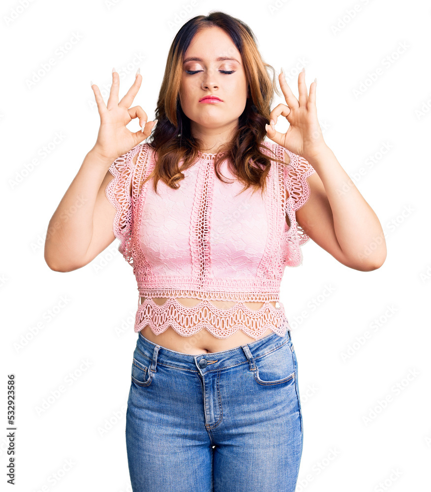 Young beautiful caucasian woman wearing casual clothes relax and smiling with eyes closed doing meditation gesture with fingers. yoga concept. Young beautiful caucasian woman wearing casual clothes relax and smiling with eyes closed doing meditation gesture with fingers. yoga concept.
