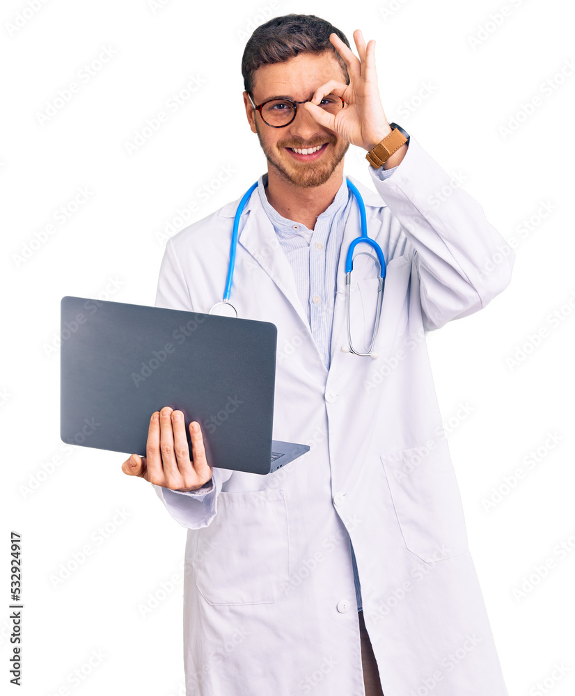 Handsome young man with bear wearing doctor uniform working using computer laptop smiling happy doing ok sign with hand on eye looking through fingers Handsome young man with bear wearing doctor uniform working using computer laptop smiling happy doing ok sign with hand on eye looking through fingers