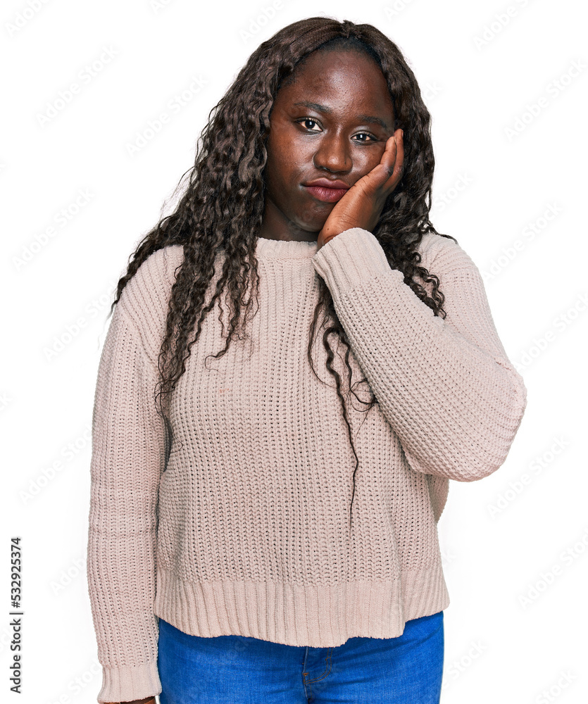 Young african woman wearing wool winter sweater thinking looking tired and bored with depression problems with crossed arms. Young african woman wearing wool winter sweater thinking looking tired and bored with depression problems with crossed arms.
