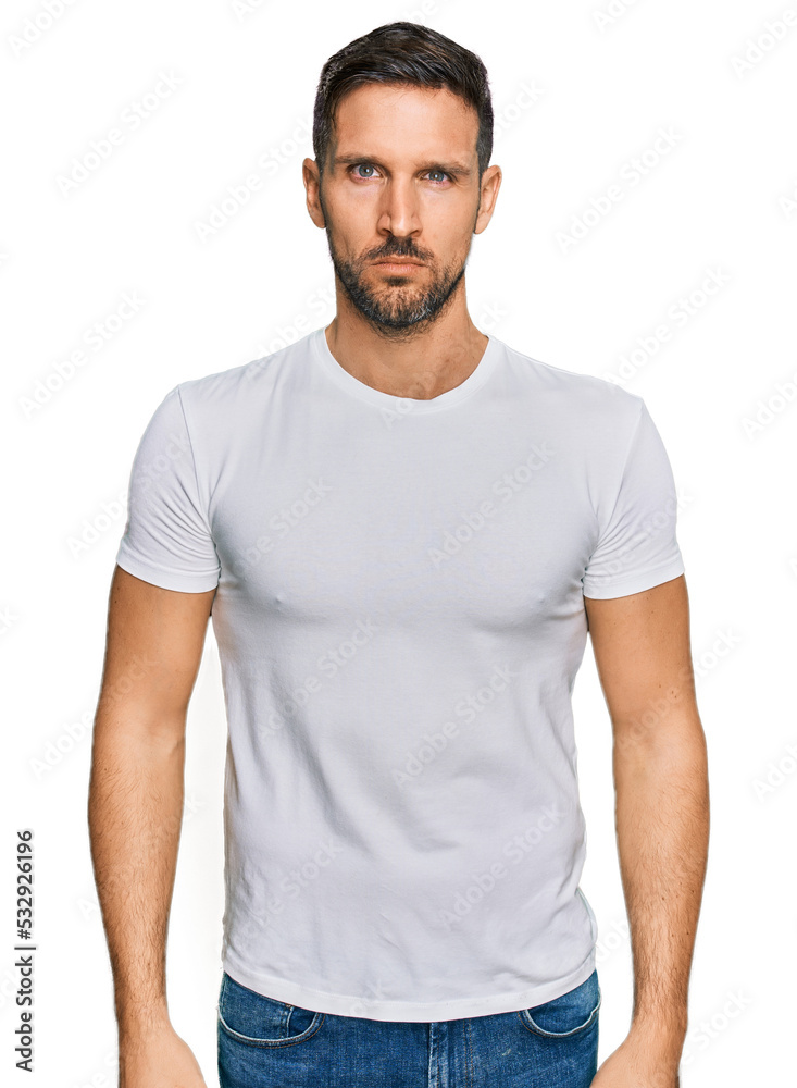 Handsome man with beard wearing casual white t shirt skeptic and nervous, frowning upset because of problem. negative person. Handsome man with beard wearing casual white t shirt skeptic and nervous, frowning upset because of problem. negative person.