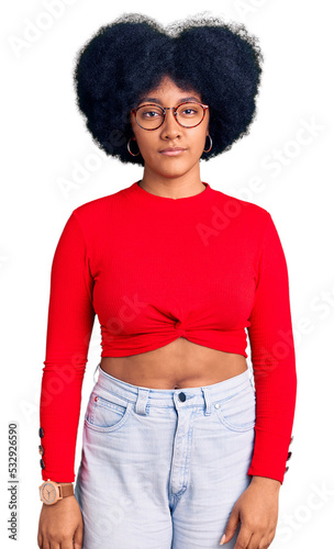 Young african american girl wearing casual clothes and glasses looking sleepy and tired, exhausted for fatigue and hangover, lazy eyes in the morning.