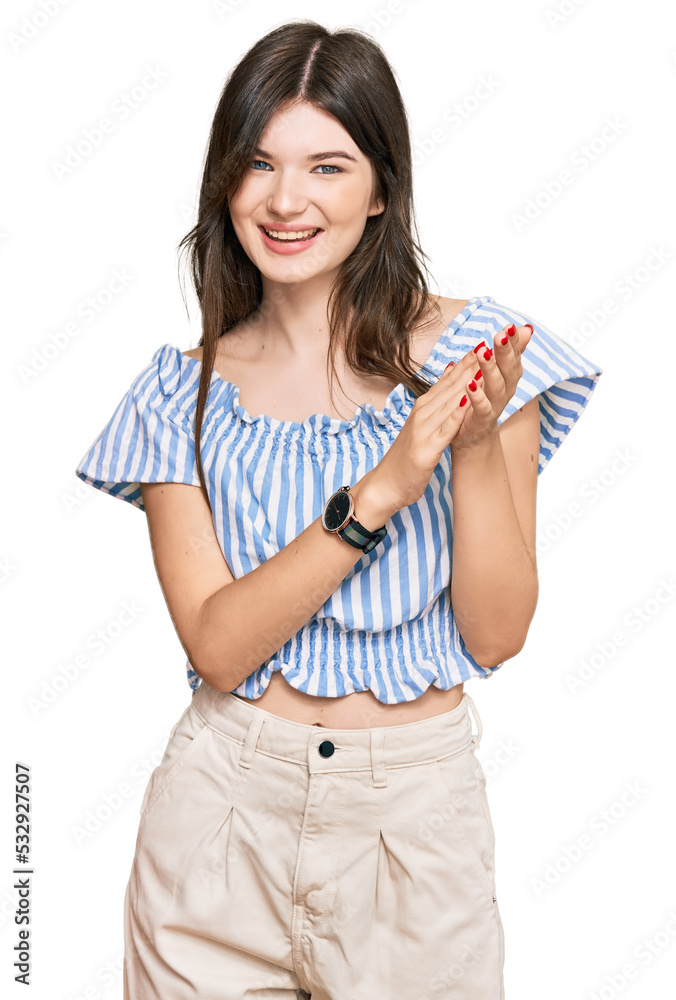 Young beautiful caucasian girl wearing casual clothes clapping and applauding happy and joyful, smiling proud hands together Young beautiful caucasian girl wearing casual clothes clapping and applauding happy and joyful, smiling proud hands together
