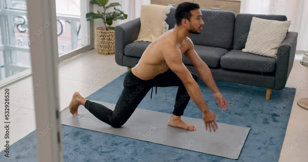 Asian man does yoga exercise from home, working out and stretching. Great for stress, cardiovascular health and mental health. Fitness, exercising and taking care of your body done in his living room