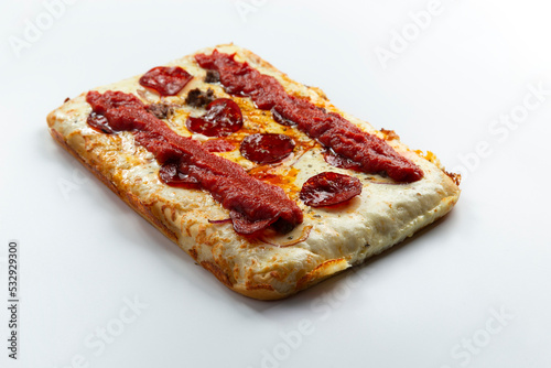 Detroit pizza on a light background.