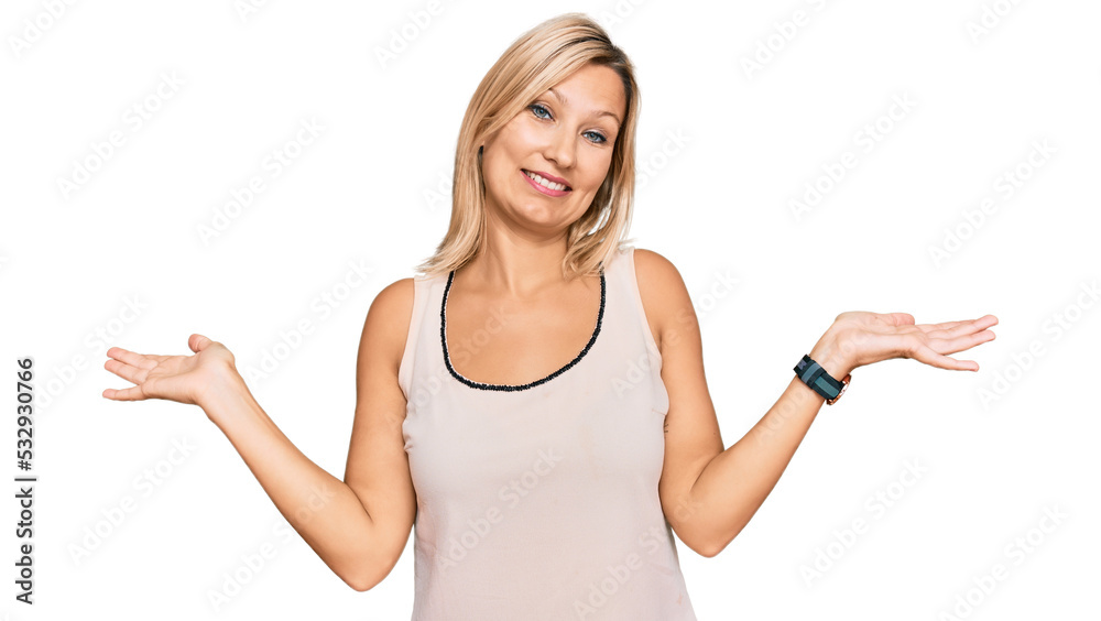 Middle age caucasian woman wearing casual clothes smiling showing both hands open palms, presenting and advertising comparison and balance Middle age caucasian woman wearing casual clothes smiling showing both hands open palms, presenting and advertising comparison and balance