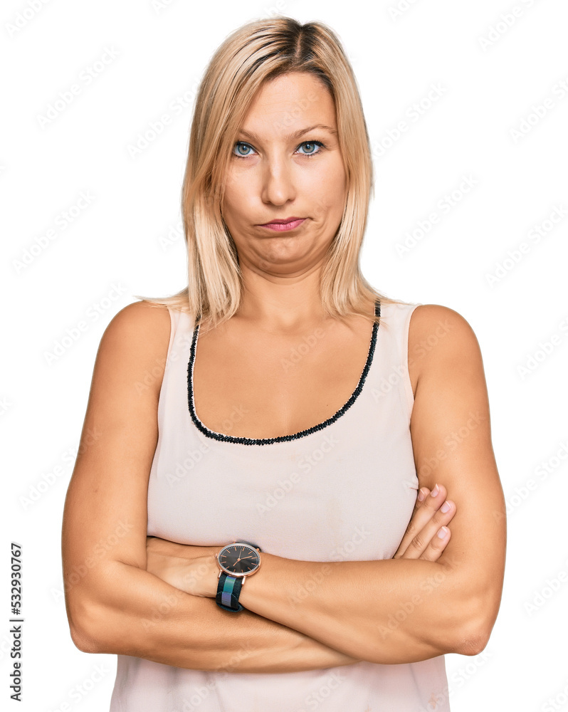 Middle age caucasian woman wearing casual clothes skeptic and nervous, disapproving expression on face with crossed arms. negative person. Middle age caucasian woman wearing casual clothes skeptic and nervous, disapproving expression on face with crossed arms. negative person.
