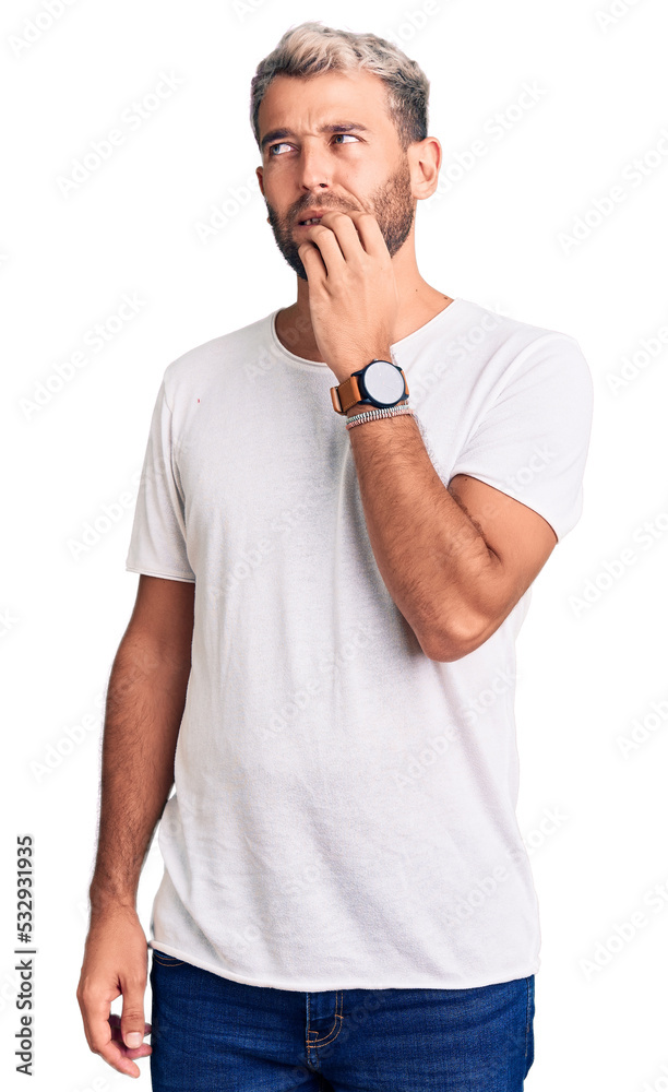 Young handsome blond man wearing casual t-shirt pointing finger up with successful idea. exited and happy. number one. Young handsome blond man wearing casual t-shirt pointing finger up with successful idea. exited and happy. number one.
