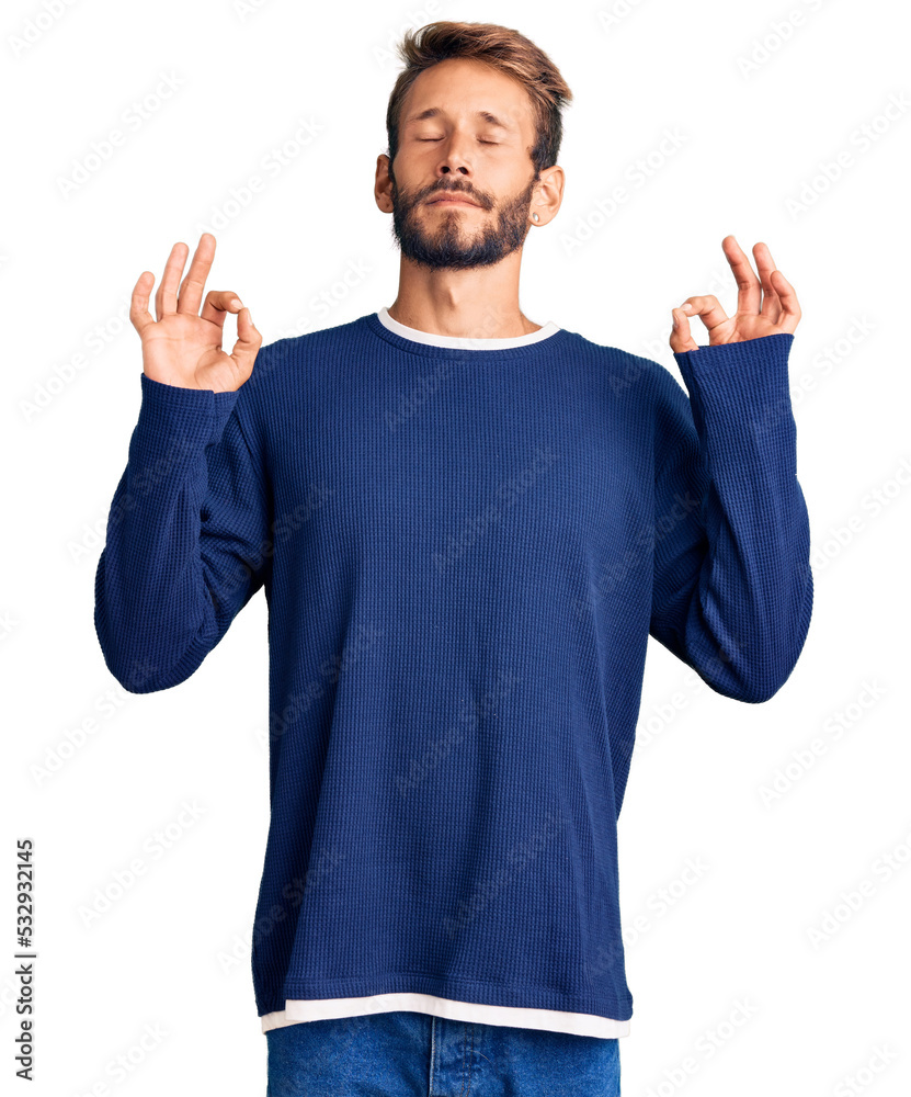 Handsome blond man with beard wearing casual sweater relaxed and smiling with eyes closed doing meditation gesture with fingers. yoga concept.