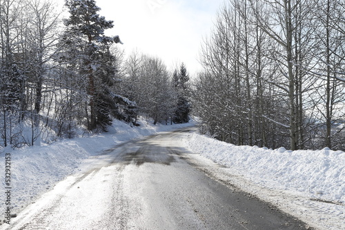 scenic view of empty road with snow covered landscape while snowing in winter season.turkey