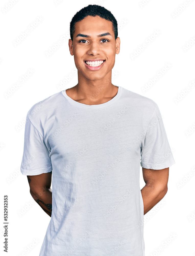 Young hispanic man wearing casual white t shirt with a happy and cool smile on face. lucky person. Young hispanic man wearing casual white t shirt with a happy and cool smile on face. lucky person.