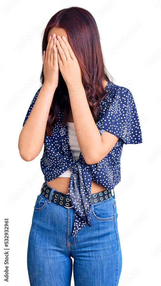 Young beautiful chinese girl wearing casual clothes with sad expression covering face with hands while crying. depression concept. Young beautiful chinese girl wearing casual clothes with sad expression covering face with hands while crying. depression concept.