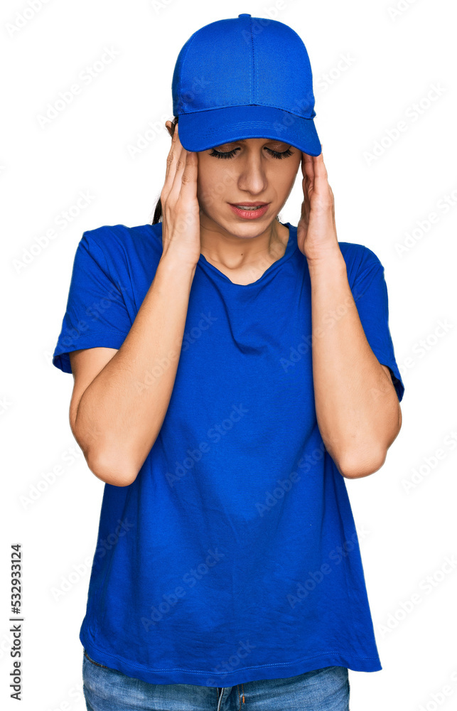 Young hispanic girl wearing delivery courier uniform with hand on head for pain in head because stress. suffering migraine.