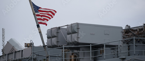 Canvas Print A FLAG ON A WARSHIP - American  amphibious assault ship on a visit to the port
