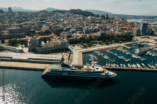 Aerial drone view of cruise ship, marina and view of centre of Vigo, Galicia, Spain photo