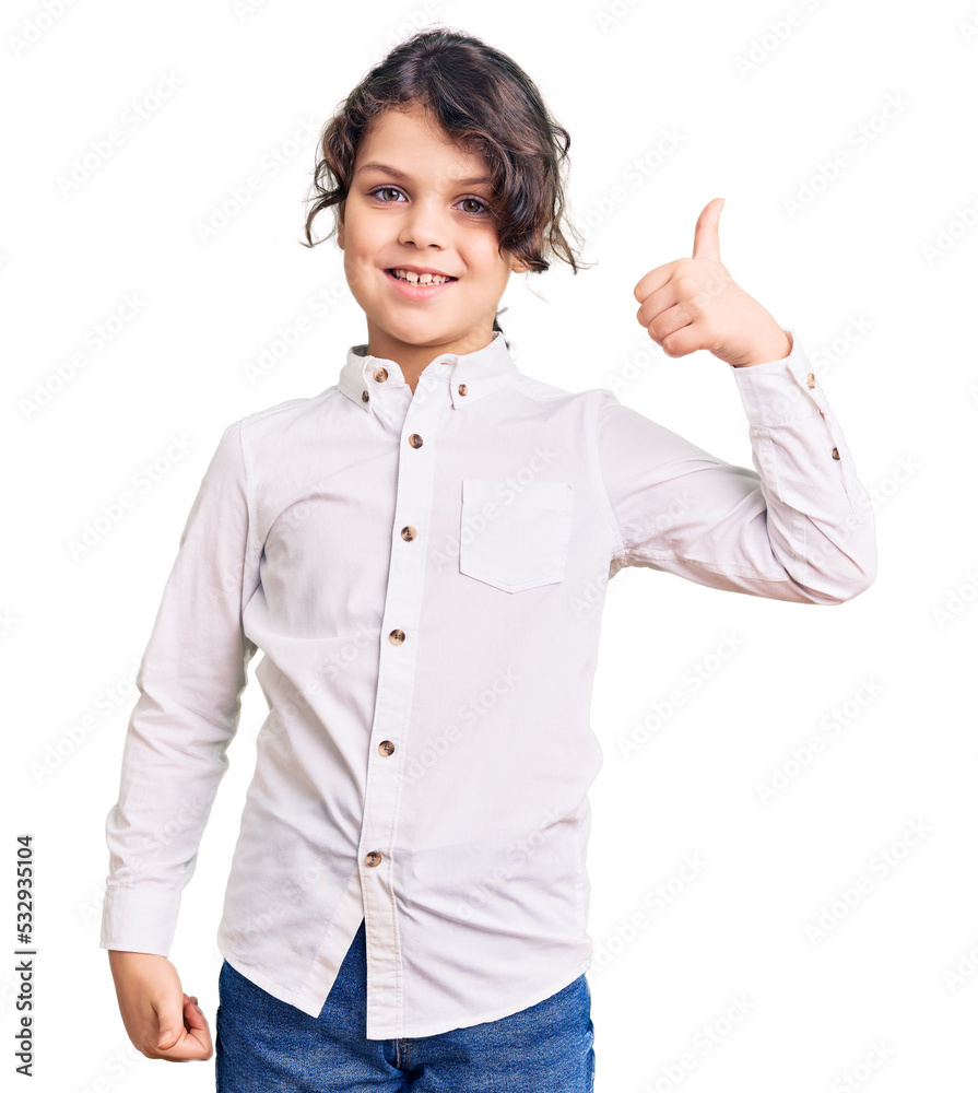 Cute hispanic child wearing casual clothes smiling happy and positive, thumb up doing excellent and approval sign Cute hispanic child wearing casual clothes smiling happy and positive, thumb up doing excellent and approval sign