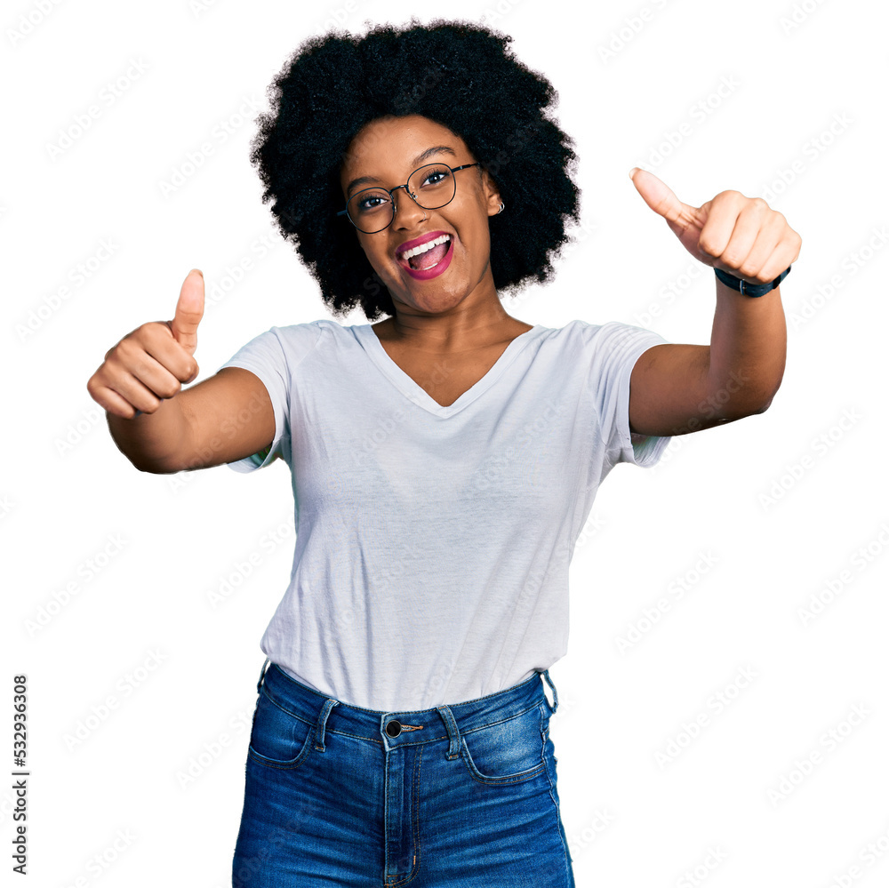 Young african american woman wearing casual white t shirt approving doing positive gesture with hand, thumbs up smiling and happy for success. winner gesture. Young african american woman wearing casual white t shirt approving doing positive gesture with hand, thumbs up smiling and happy for success. winner gesture.