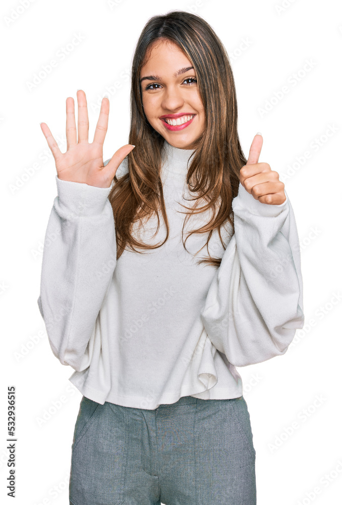 Young brunette woman wearing casual turtleneck sweater showing and pointing up with fingers number six while smiling confident and happy. Young brunette woman wearing casual turtleneck sweater showing and pointing up with fingers number six while smiling confident and happy.