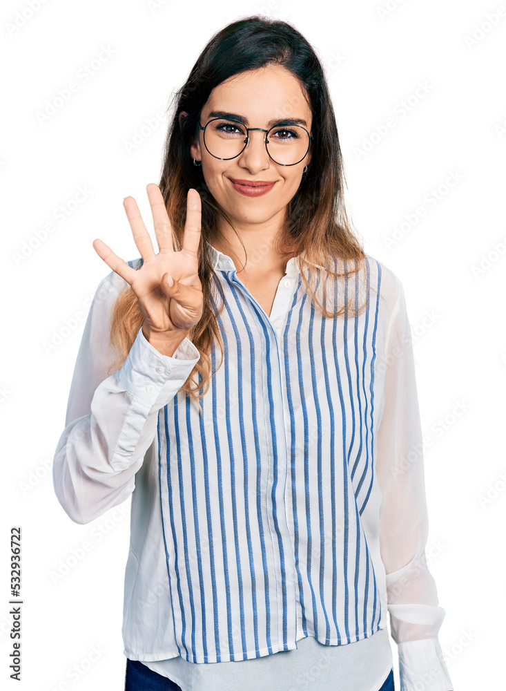 Beautiful hispanic woman wearing casual striped shirt showing and pointing up with fingers number four while smiling confident and happy. Beautiful hispanic woman wearing casual striped shirt showing and pointing up with fingers number four while smiling confident and happy.