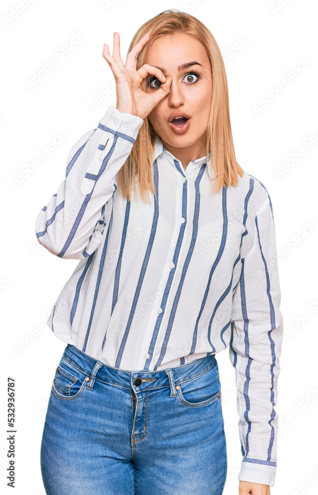 Beautiful caucasian woman wearing casual clothes doing ok gesture shocked with surprised face, eye looking through fingers. unbelieving expression. Beautiful caucasian woman wearing casual clothes doing ok gesture shocked with surprised face, eye looking through fingers. unbelieving expression.