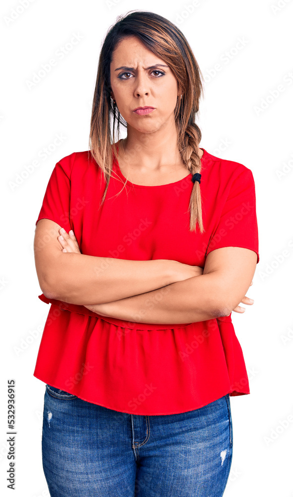 Young beautiful woman wearing casual t-shirt skeptic and nervous, disapproving expression on face with crossed arms. negative person. Young beautiful woman wearing casual t-shirt skeptic and nervous, disapproving expression on face with crossed arms. negative person.