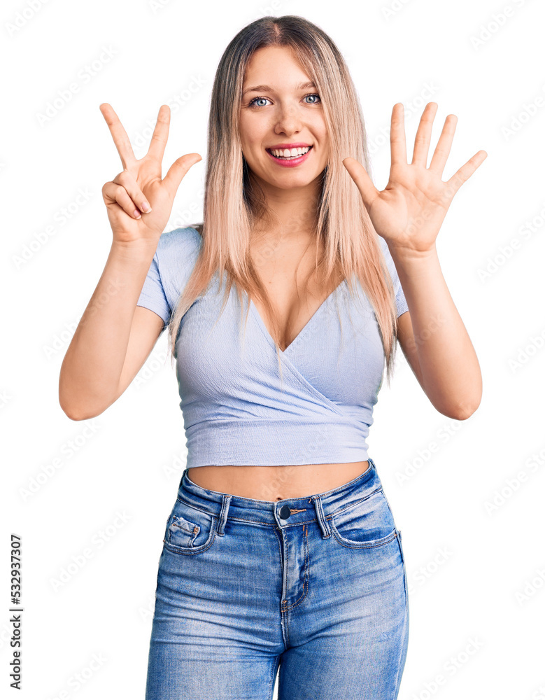 Young beautiful blonde woman wearing casual clothes showing and pointing up with fingers number eight while smiling confident and happy. Young beautiful blonde woman wearing casual clothes showing and pointing up with fingers number eight while smiling confident and happy.