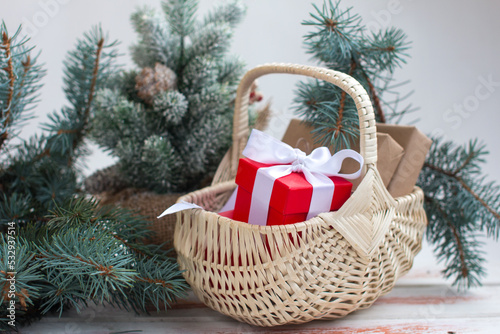 fNew Year and Christmas gifts for the Christmas tree. Gift boxes and green, blue spruce photo