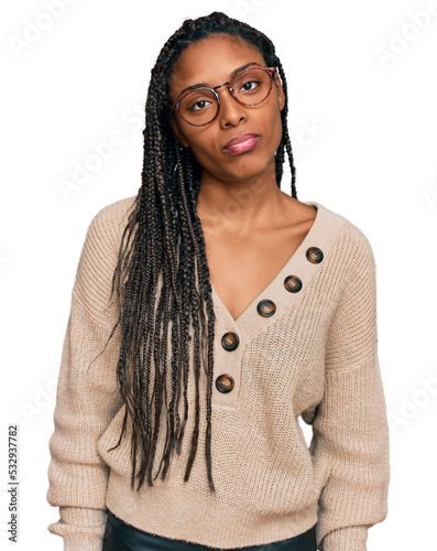 African american woman wearing casual clothes looking sleepy and tired, exhausted for fatigue and hangover, lazy eyes in the morning.