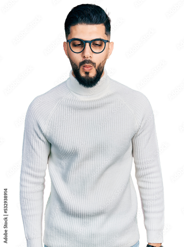 A man with a goatee and a turtle neck sweater photo – Man face