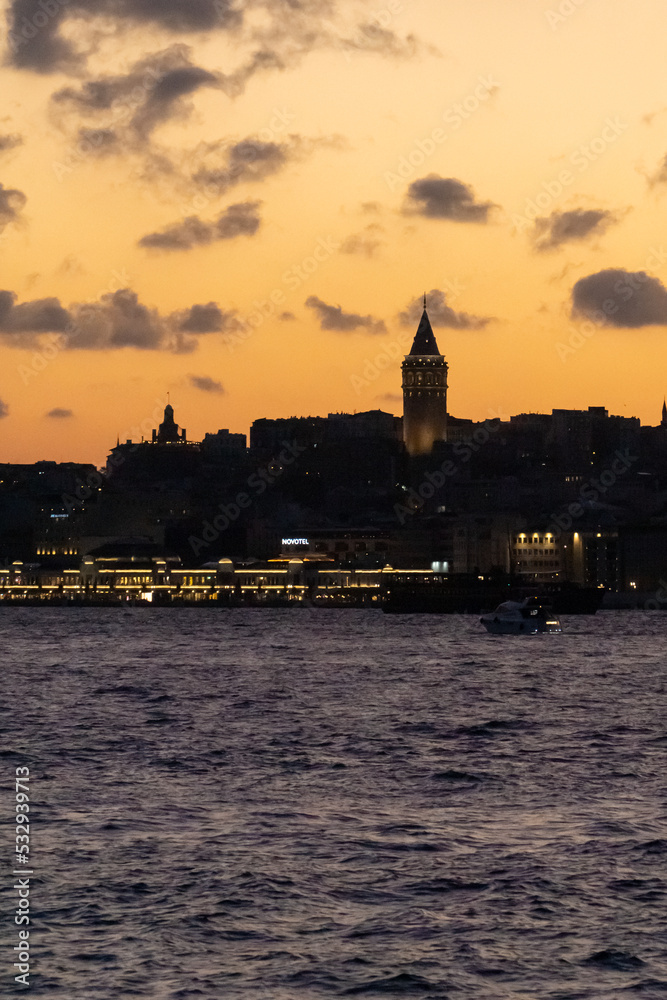 Landscape of galata tower and bosphorus at sunset in portrait format - istanbul, turkey