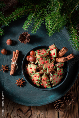 Sweet and tasty gingerbread cookies for Christmas in wooden bowl.