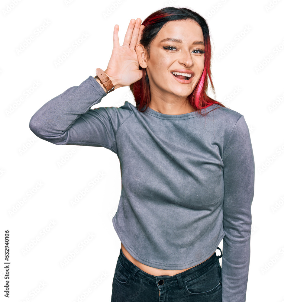 Fototapeta premium Young caucasian woman wearing casual clothes smiling with hand over ear listening an hearing to rumor or gossip. deafness concept.