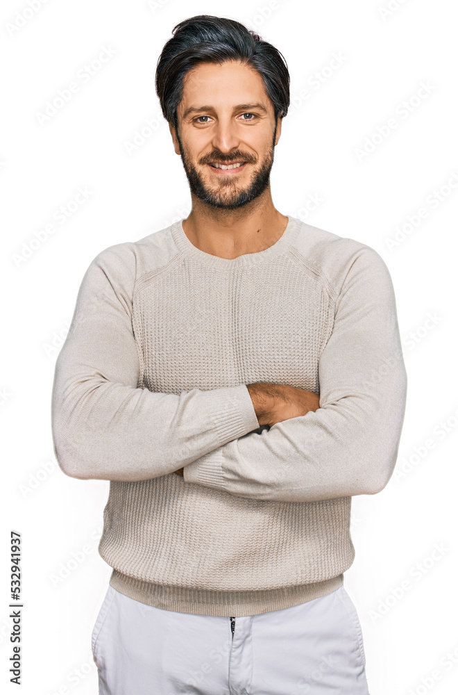 Young hispanic man wearing casual clothes happy face smiling with crossed arms looking at the camera. positive person. Young hispanic man wearing casual clothes happy face smiling with crossed arms looking at the camera. positive person.