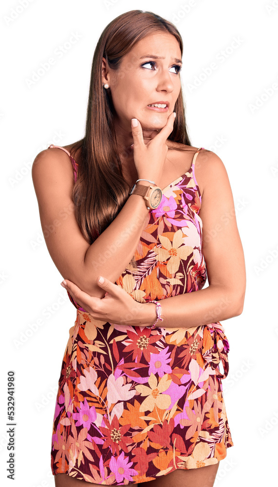 Young beautiful hispanic woman wearing casual clothes thinking worried about a question, concerned and nervous with hand on chin Young beautiful hispanic woman wearing casual clothes thinking worried about a question, concerned and nervous with hand on chin