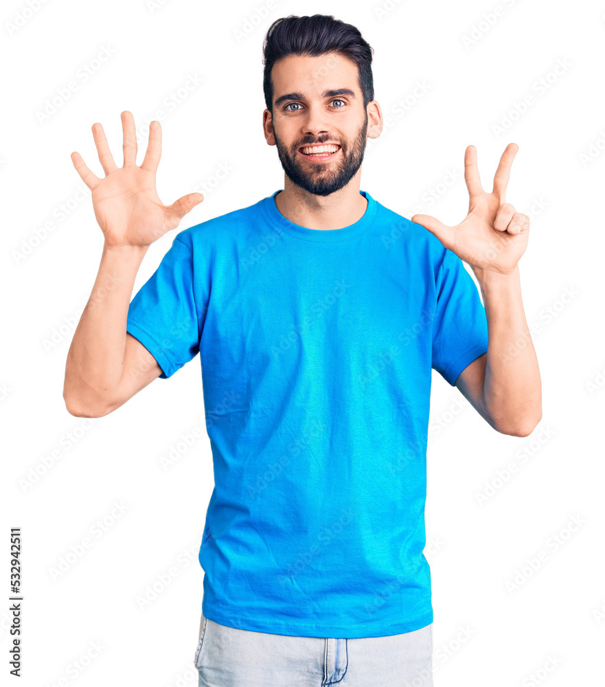 Young handsome man with beard wearing casual t-shirt showing and pointing up with fingers number eight while smiling confident and happy. Young handsome man with beard wearing casual t-shirt showing and pointing up with fingers number eight while smiling confident and happy.