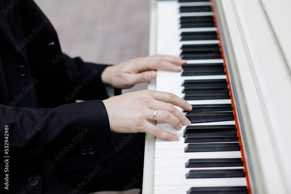 Man hands playing piano. Classical music. Art and abstract background. Man hands playing piano. Classical music. Art and abstract background.