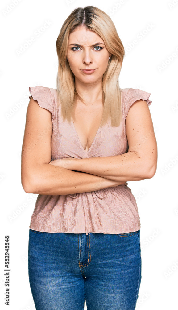 Young caucasian woman wearing casual clothes skeptic and nervous, disapproving expression on face with crossed arms. negative person.