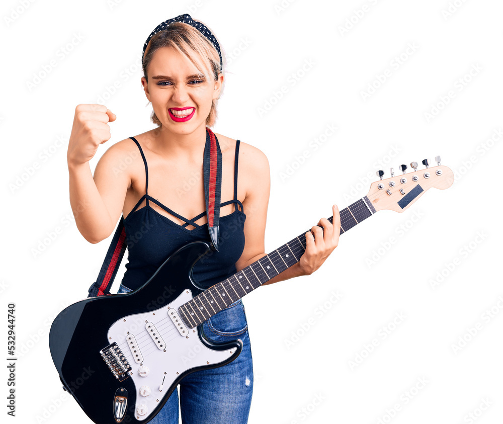 Young beautiful blonde woman playing electric guitar annoyed and frustrated shouting with anger, yelling crazy with anger and hand raised