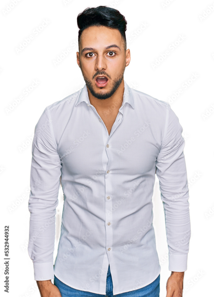 Young arab man wearing casual clothes afraid and shocked with surprise expression, fear and excited face. Young arab man wearing casual clothes afraid and shocked with surprise expression, fear and excited face.