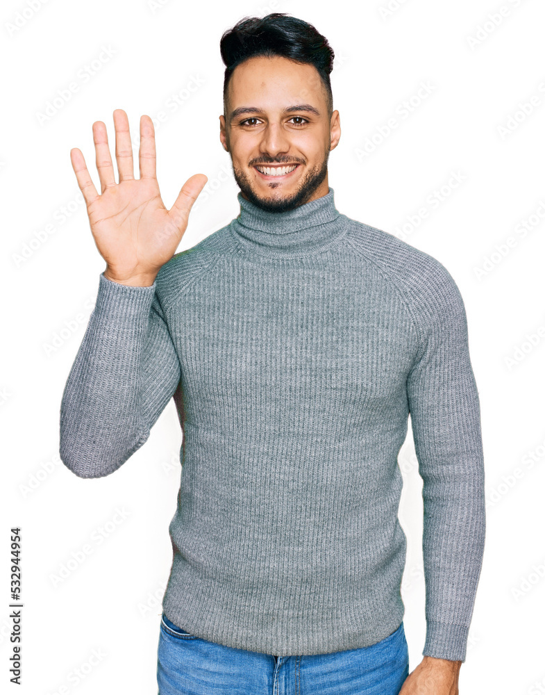 Young arab man wearing casual clothes showing and pointing up with fingers number five while smiling confident and happy. Young arab man wearing casual clothes showing and pointing up with fingers number five while smiling confident and happy.