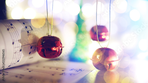 Christmas carol with jingle bells and candles