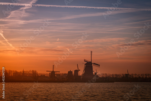 dutch windmill at sunset © Johan