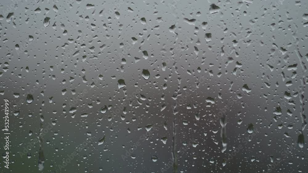 Real background of rain hitting glass window Real background of rain hitting glass window