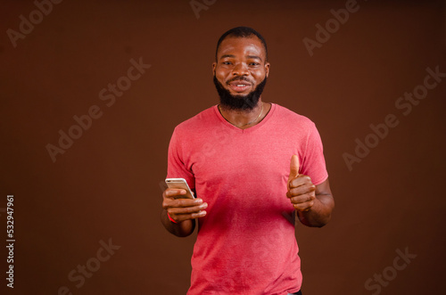 handsome african guy isolated smiling and did thumbs up